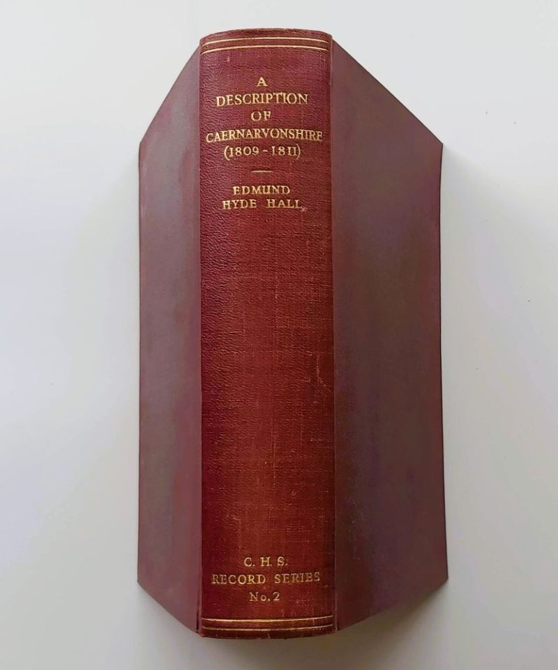 Description of Caernarvonshire 1809 1811 (2) A standing view of the book spine bound in maroon cloth, displaying clean gold-stamped lettering reading "A DESCRIPTION OF CAERNARVONSHIRE (1809-1811)", "EDMUND HYDE HALL", and "C.H.S. RECORD SERIES No. 2".