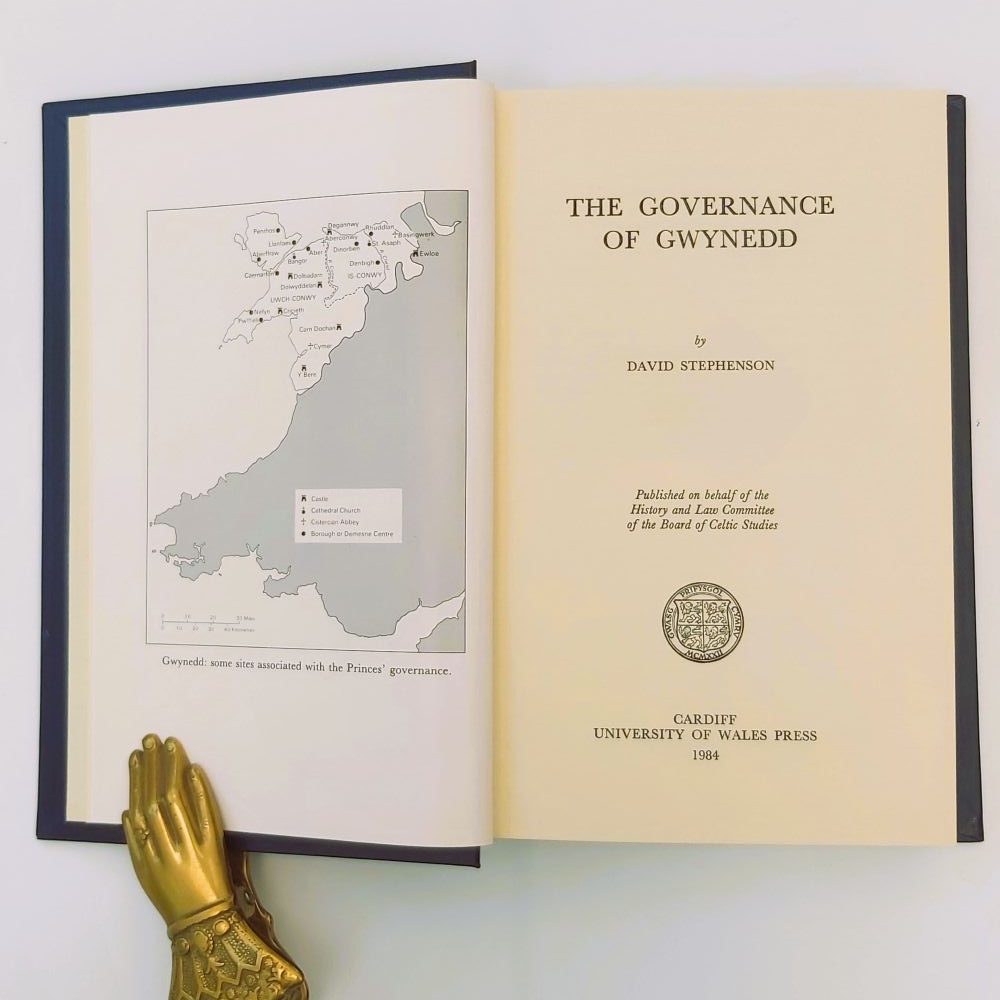 Governance of Gwynedd Open title page of the book dated 1984, alongside a monochrome historical map plate showing the geography of Gwynedd and historical sites associated with the medieval Welsh princes.Stephenson (4)a