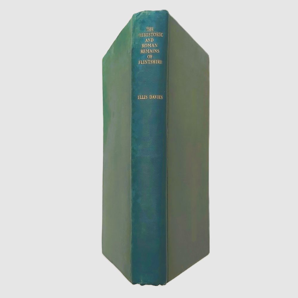 Prehistoric and Roman Remains of Flintshire Davies (2)a Standing spine view of the book bound in dark green cloth, showing gold-stamped lettering reading "THE PREHISTORIC AND ROMAN REMAINS OF FLINTSHIRE" and the author's name "ELLIS DAVIES".